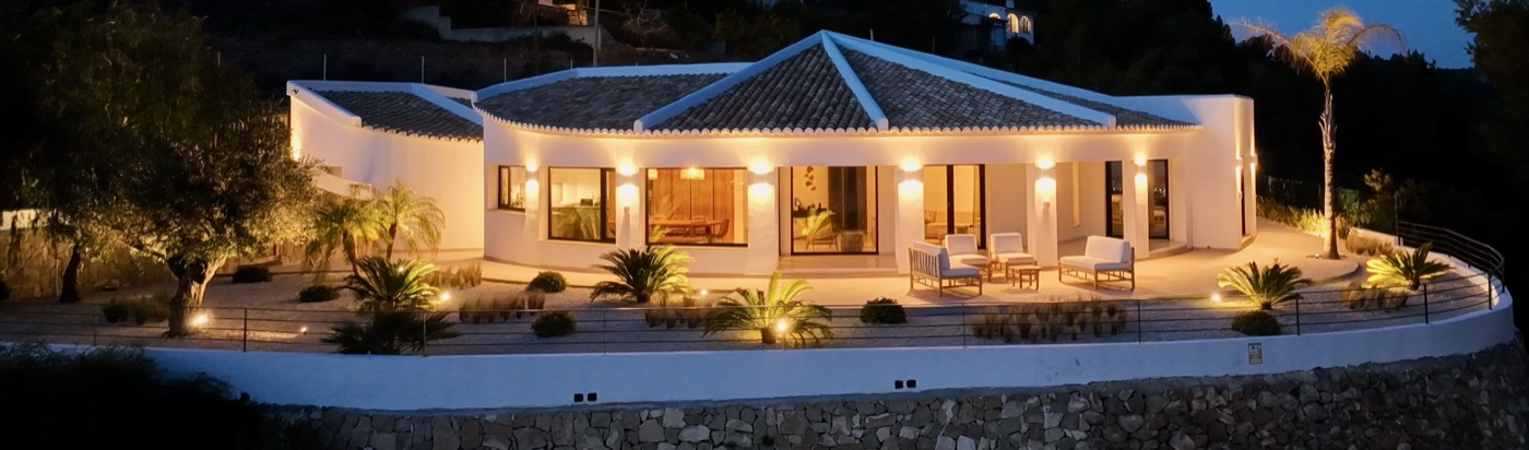 Night aerial view of Casa Monte Verde fully illuminated