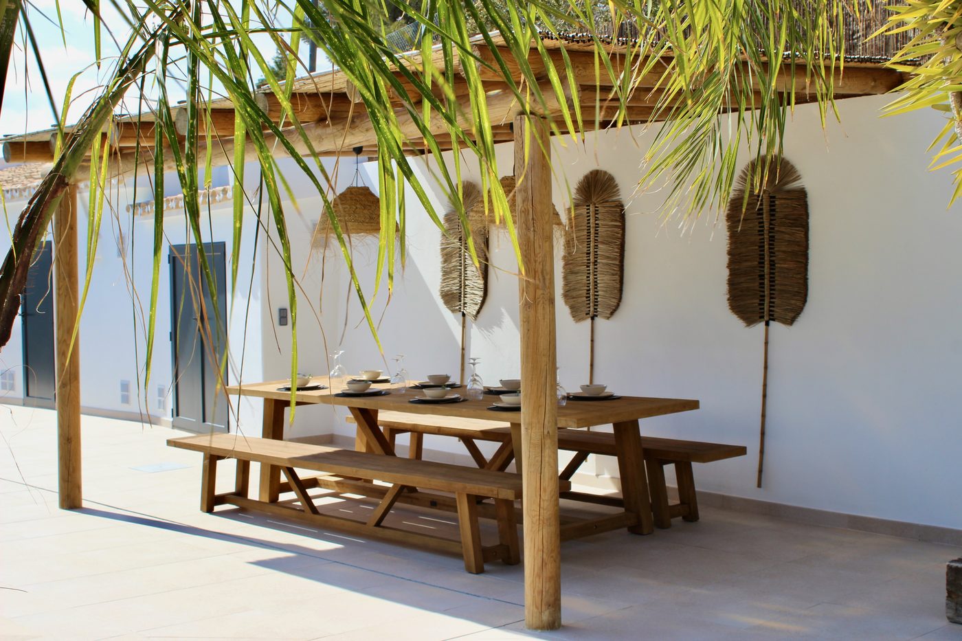 Outdoor dining table set for al fresco dining under the pergola